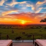 Luxury safari at sunset with exotic wildlife and tents.