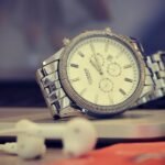 round silver-colored analog watch with link bracelet